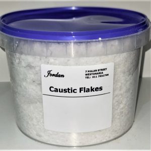 Caustic flakes